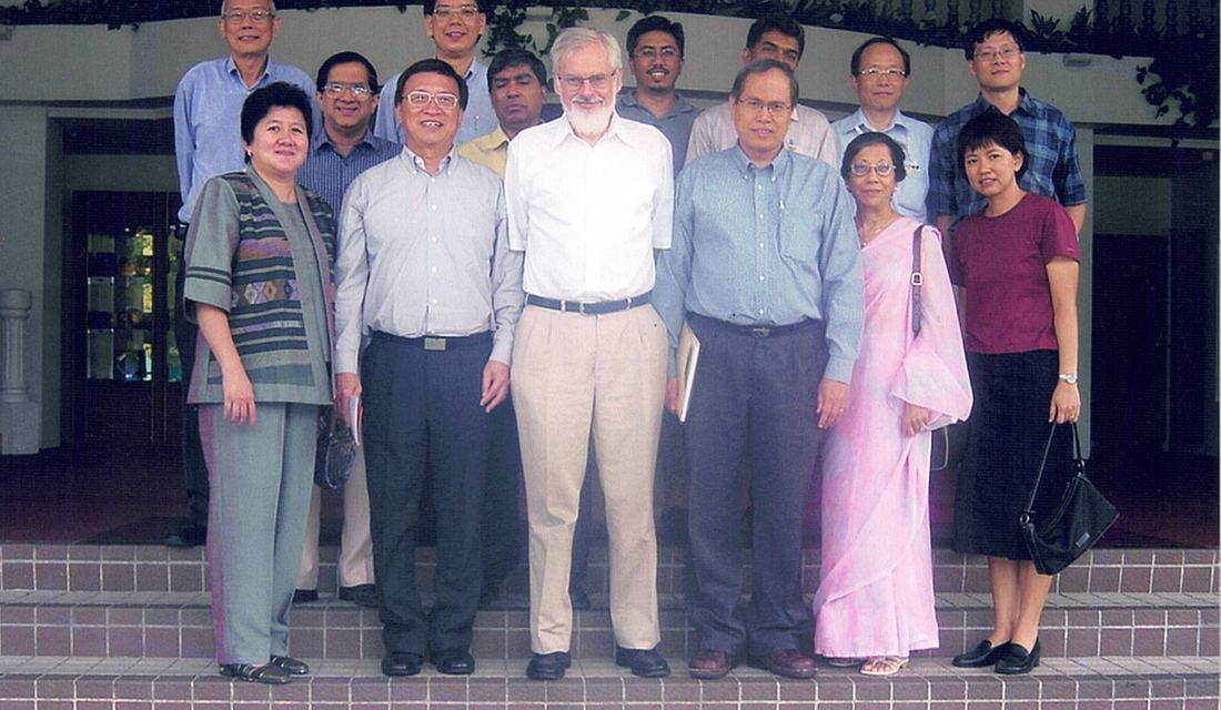 Faculty members of the Department of Economics in the mid-2000s, with then-Head of Department Åke Blomqvist (front, centre). Lee Soo Ann and Amina Tyabji, both from the 1960 graduating class, are also pictured.