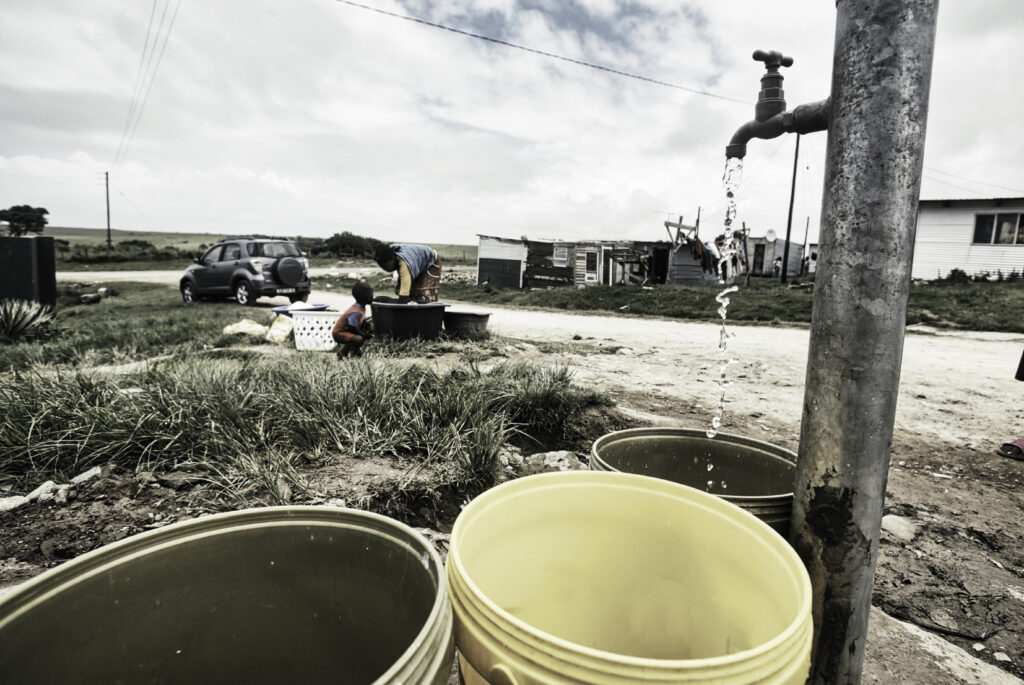 Water running out of a faucet in a rural area in Africa