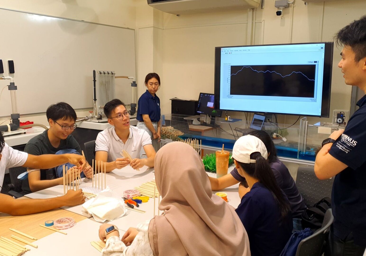 The hands-on experiential learning segment of the hydraulics lab tour allowed prospective students to experience an actual class.