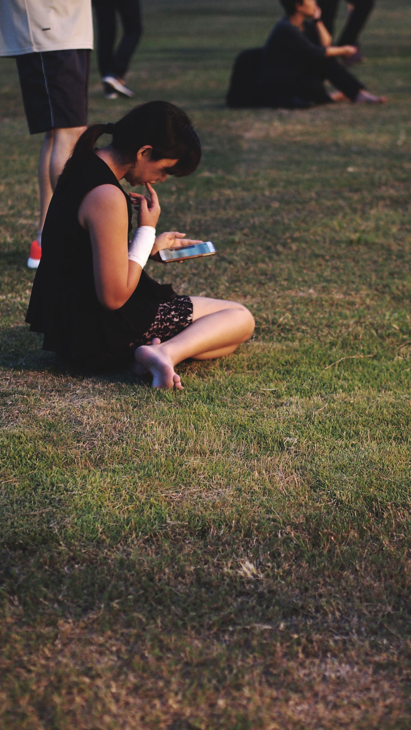 lady using smartphone in field