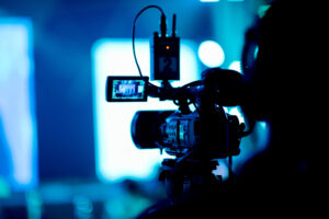 videographer close up, cameraman, man with camera, movie,"n