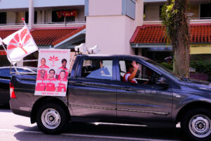 Singapore July 02 2020 Driver of PSP (Progress Singapore Party; not Playstation) vehicle waves to people during campaign drive around in the heartlands; Singapore Elections 2020