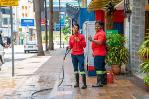 Utility workers in Malaysia wash the streets of the city. Malaysia Utilities. Kuala Lumpur / Malaysia - 04.24.2020