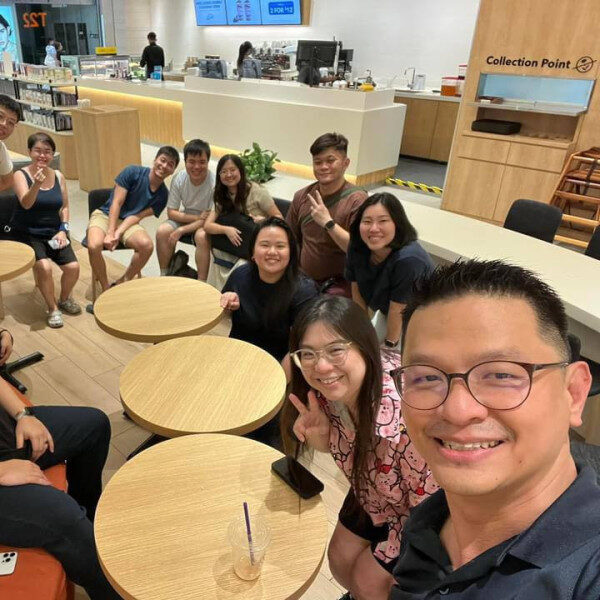 Quan Xuan (seventh from right) at a sign language community event.
